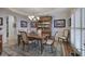 Formal dining room with detailed trimwork, traditional furniture, and view of hardwood flooring and staircase at 2139 Golden Morning Ct, Kennesaw, GA 30152