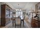 Dining room showcasing tray ceiling, large china cabinet, and access to the foyer at 2139 Golden Morning Ct, Kennesaw, GA 30152