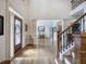 Open foyer featuring hardwood floors, staircase, and views into the living spaces at 2139 Golden Morning Ct, Kennesaw, GA 30152