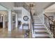 Elegant foyer with hardwood floors, staircase with iron spindles, and decorative columns at 2139 Golden Morning Ct, Kennesaw, GA 30152