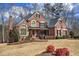 Charming brick home with a well-maintained lawn and colorful shrubs, creating an inviting curb appeal at 2139 Golden Morning Ct, Kennesaw, GA 30152