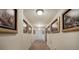 Hallway with shelves of movies and framed art on the walls at 2139 Golden Morning Ct, Kennesaw, GA 30152