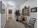 Hallway featuring decor with a wooden shelf displaying plants and a quaint chair at 2139 Golden Morning Ct, Kennesaw, GA 30152