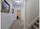 Hallway with neutral carpeting, white walls, framed artwork and access to other rooms at 2139 Golden Morning Ct, Kennesaw, GA 30152