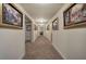 Long hallway adorned with framed pictures, recessed lighting and neutral carpeting at 2139 Golden Morning Ct, Kennesaw, GA 30152