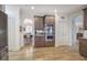Kitchen showcasing stainless steel double ovens and cabinetry, leading to the dining area at 2139 Golden Morning Ct, Kennesaw, GA 30152