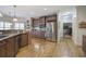 Modern kitchen featuring stainless steel appliances, custom cabinetry, and beautiful granite countertops with hardwood floors at 2139 Golden Morning Ct, Kennesaw, GA 30152