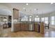 Open concept kitchen with granite countertops, stainless steel appliances, and seamless transition to the dining area at 2139 Golden Morning Ct, Kennesaw, GA 30152