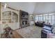 Cozy living room with stone fireplace, built-in bookshelves, and comfortable seating at 2139 Golden Morning Ct, Kennesaw, GA 30152