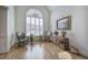 Bright living room with hardwood floors, rocking chairs, and ample natural light at 2139 Golden Morning Ct, Kennesaw, GA 30152