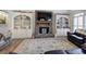 Inviting living room with stone fireplace, built-in shelving, and comfortable sofas at 2139 Golden Morning Ct, Kennesaw, GA 30152