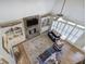 Open-concept living room with stone fireplace, built-in shelving, and hardwood flooring at 2139 Golden Morning Ct, Kennesaw, GA 30152