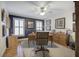 Well-lit office featuring hardwood floors, shuttered windows, and a traditional wooden desk and credenza at 2139 Golden Morning Ct, Kennesaw, GA 30152