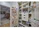 Walk-in pantry with organized shelving, drawers, and ample storage for dry goods and household items at 2139 Golden Morning Ct, Kennesaw, GA 30152