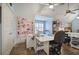 Craft room featuring custom workspace, hardwood floors, and a large patterned quilt at 2139 Golden Morning Ct, Kennesaw, GA 30152