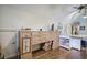 Craft room with hardwood floors, built-in storage, and custom worktables at 2139 Golden Morning Ct, Kennesaw, GA 30152