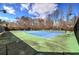 Community tennis court with well-maintained surfaces and lighting, offering residents an opportunity for recreation and exercise at 2139 Golden Morning Ct, Kennesaw, GA 30152