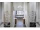 Dual walk-in closets leading to a bathroom with tub and tiled floor at 2139 Golden Morning Ct, Kennesaw, GA 30152