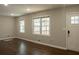 Bright living room with hardwood flooring and double-hung windows filling the space with natural light at 2486 Rockcliff Se Rd, Atlanta, GA 30316