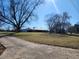 View of the house, from the driveway across the lawn at 46 Mac Johnson Nw Rd, Cartersville, GA 30121