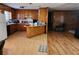 Kitchen features include wood cabinets and flooring with an adjoining breakfast bar at 46 Mac Johnson Nw Rd, Cartersville, GA 30121