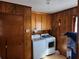 Laundry room features a washer, dryer and hanging wood storage at 46 Mac Johnson Nw Rd, Cartersville, GA 30121
