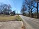 This is a road view image of the neighborhood near a grassy lawn at 46 Mac Johnson Nw Rd, Cartersville, GA 30121
