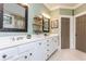 Stylish bathroom featuring a double vanity with white countertops and modern fixtures at 730 Jackson Miller Cir, Powder Springs, GA 30127