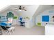 View of an attic bedroom with colorful blue and green accents, a ceiling fan and plush carpeting at 730 Jackson Miller Cir, Powder Springs, GA 30127