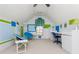 Attic bedroom with colorful accents, white walls and carpet, large window and a ceiling fan at 730 Jackson Miller Cir, Powder Springs, GA 30127