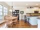 Open dining area connecting to the kitchen, featuring hardwood floors and ample natural light at 730 Jackson Miller Cir, Powder Springs, GA 30127