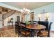 Formal dining room with wood table, wainscoting, and chandelier at 730 Jackson Miller Cir, Powder Springs, GA 30127