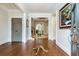 Spacious foyer with hardwood floors, elegant table, and view of the staircase and upper level at 730 Jackson Miller Cir, Powder Springs, GA 30127