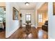 Elegant foyer with hardwood floors, decorative table, and tasteful décor, creating a warm entrance at 730 Jackson Miller Cir, Powder Springs, GA 30127