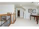 Upstairs hallway with hardwood banister, carpet, and views to other rooms at 730 Jackson Miller Cir, Powder Springs, GA 30127