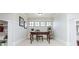 Charming home office featuring a desk, chair, bookshelves, and natural light from the windows at 730 Jackson Miller Cir, Powder Springs, GA 30127