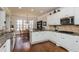 Bright kitchen with stainless steel appliances, granite countertops, and adjacent dining area at 730 Jackson Miller Cir, Powder Springs, GA 30127