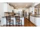 Bright, modern kitchen featuring granite countertops, stainless steel appliances, and counter seating at 730 Jackson Miller Cir, Powder Springs, GA 30127