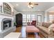 Inviting living room featuring a fireplace, large windows, and comfortable seating at 730 Jackson Miller Cir, Powder Springs, GA 30127