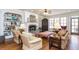 Comfortable living room with fireplace, built-in shelving, and plenty of natural light at 730 Jackson Miller Cir, Powder Springs, GA 30127