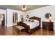 Spacious main bedroom featuring hardwood floors, decorative furniture, and neutral tones at 730 Jackson Miller Cir, Powder Springs, GA 30127