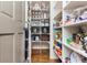 Organized walk-in pantry with abundant shelving for food storage and kitchen essentials at 730 Jackson Miller Cir, Powder Springs, GA 30127