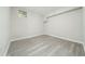 Finished basement featuring wood-look floors and a window at 2450 Spring Mill Cv, Duluth, GA 30097