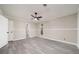 Sun-filled bedroom showcasing wood-look floors, neutral walls, and closet door at 2450 Spring Mill Cv, Duluth, GA 30097