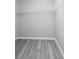 Walk-in closet with modern flooring and wire shelving ready for organization at 2450 Spring Mill Cv, Duluth, GA 30097