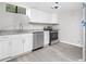 Updated kitchen featuring stainless steel appliances, white cabinets and granite countertops at 2450 Spring Mill Cv, Duluth, GA 30097