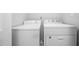 Laundry room featuring a white washer and dryer at 2450 Spring Mill Cv, Duluth, GA 30097