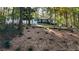 Serene wooded lot enhances this charming home's curb appeal at 2450 Spring Mill Cv, Duluth, GA 30097