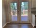 Double glass doors from the kitchen leading out to a wood deck at 2678 Brook Park Way, Atlanta, GA 30340