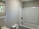 Bathroom with gray wall and shower over tub with grab bar at 2678 Brook Park Way, Atlanta, GA 30340